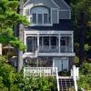 This custom Victorian cottage fits right in with the architecture found in Blodgett Landing, Newbury NH.